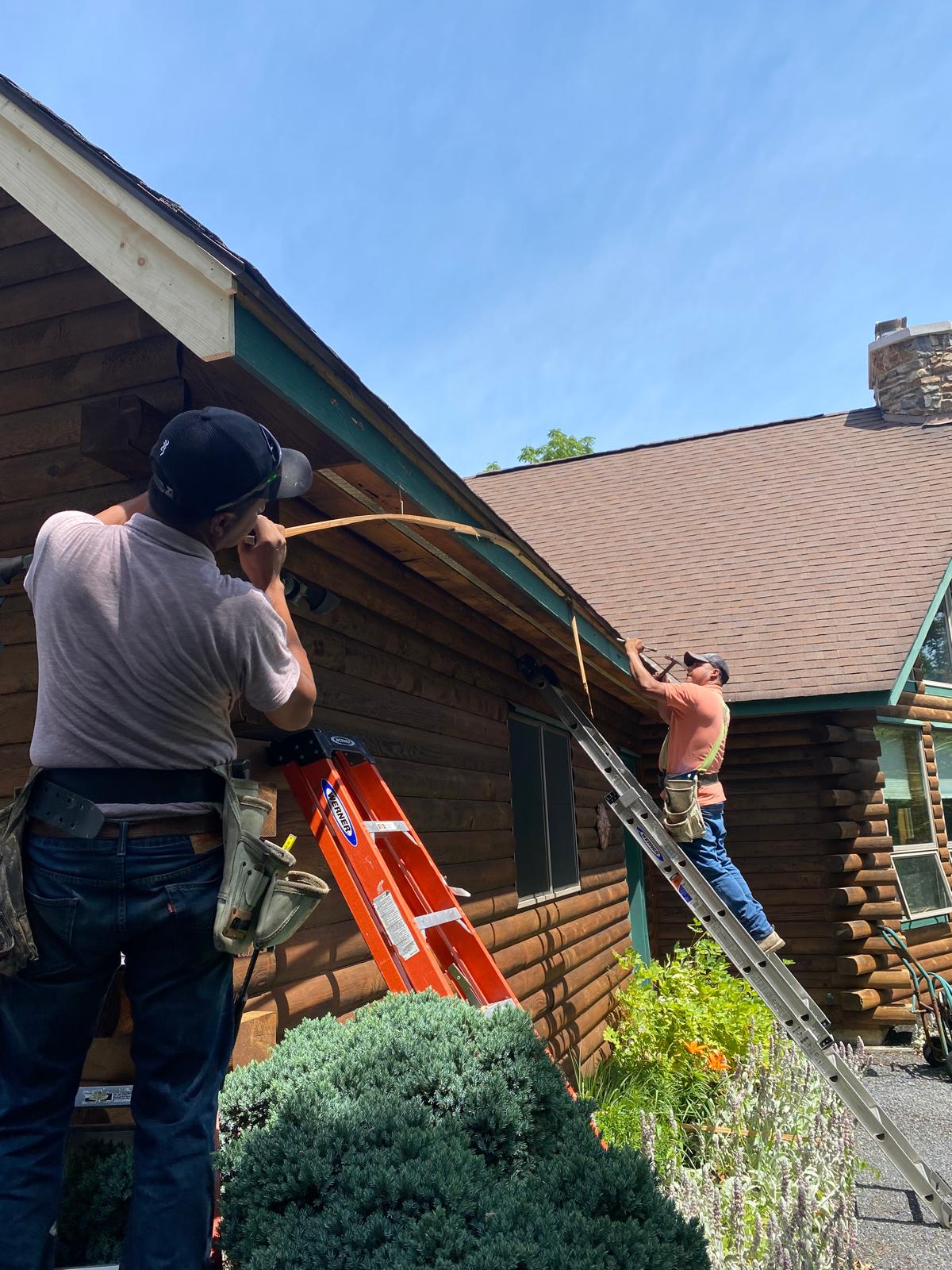 Crew installing fascia and gutter line